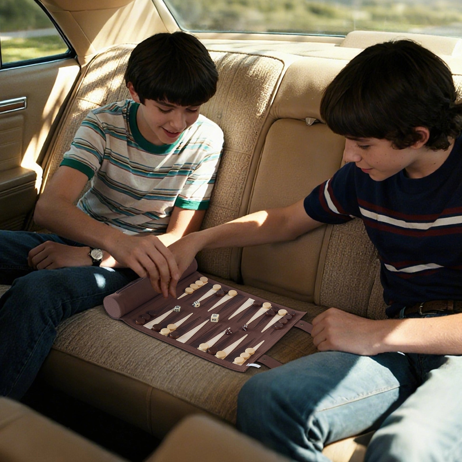 Two boys playing backgammon on a brown travel game set in a car, ideal for family road trips.