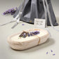 Lavender-scented white-washed wooden dough bowl candle, gift-ready with lavender accents, perfect for relaxation.