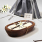 Vanilla-scented dark wood dough bowl candle, gift-ready with lily and vanilla accents, perfect for gifting.