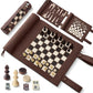 Flat lay of a brown roll-up 3-in-1 travel game set (chess, backgammon, checkers), displayed rolled and unrolled with game pieces and dice.