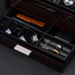 Close-up of watch box drawer with divided storage for sunglasses, watch straps, rings, and cufflinks, ideal for accessory organization.